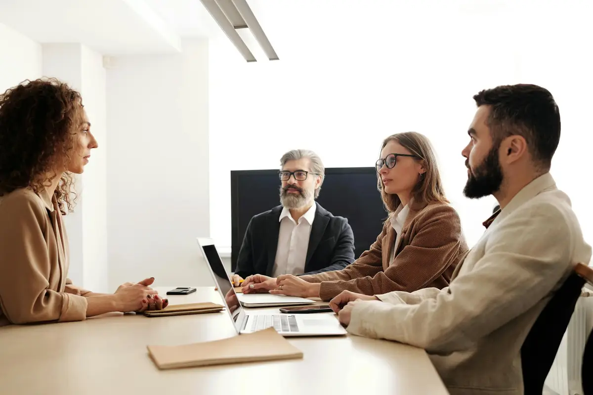 people sitting around a table in training.