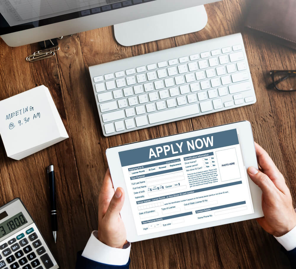 Person applying online with tablet