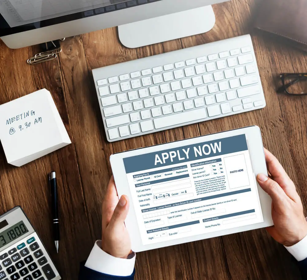 Person applying online with tablet