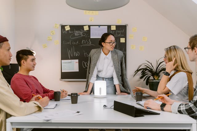 Group meeting with presentation discussion.